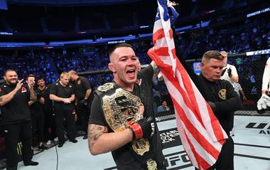 Колби Ковингтон с флагом США и поясом UFC